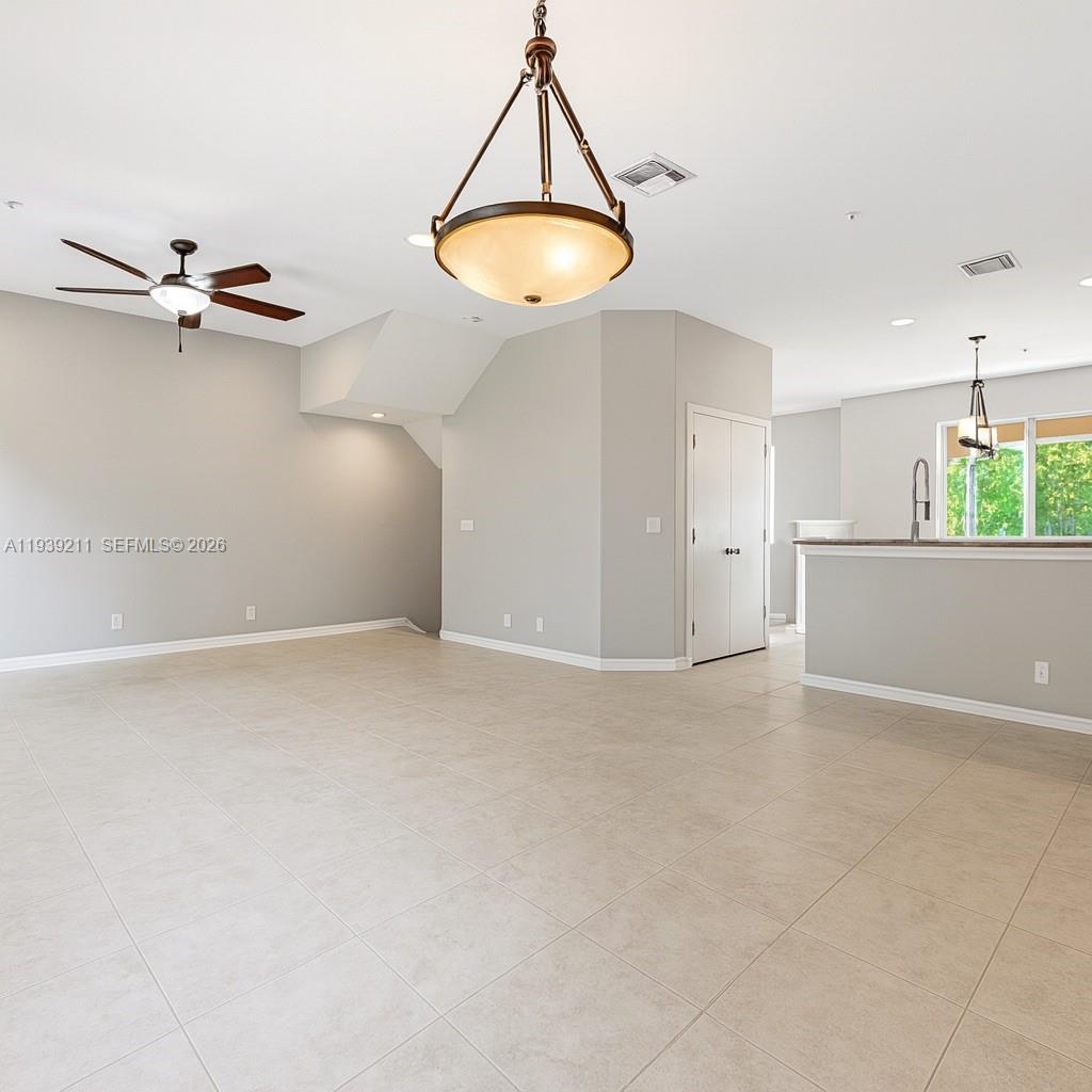 4581 Danson Way Delray Beach, FL 33445 - Photo 2 of 19 an empty room with a window and cabinet