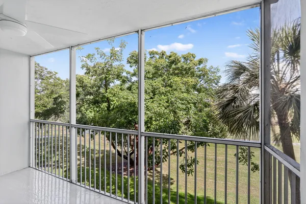 a view of a balcony with plants
