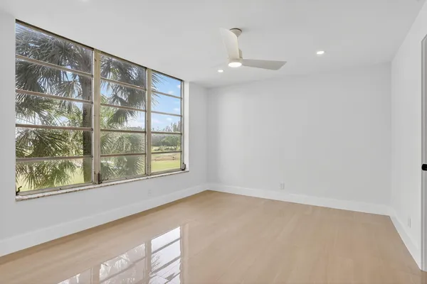 a view of an empty room with a window