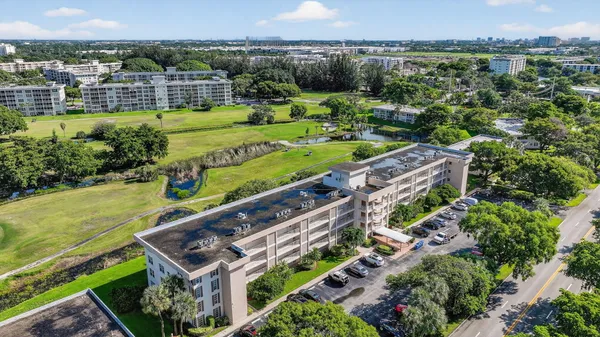 an aerial view of a house with a garden