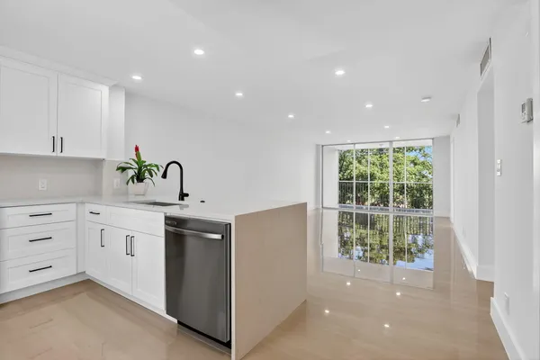a kitchen with a sink and cabinets