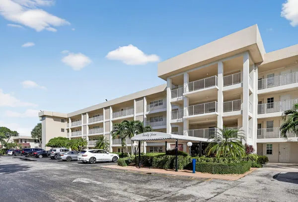 a front view of a building with street view