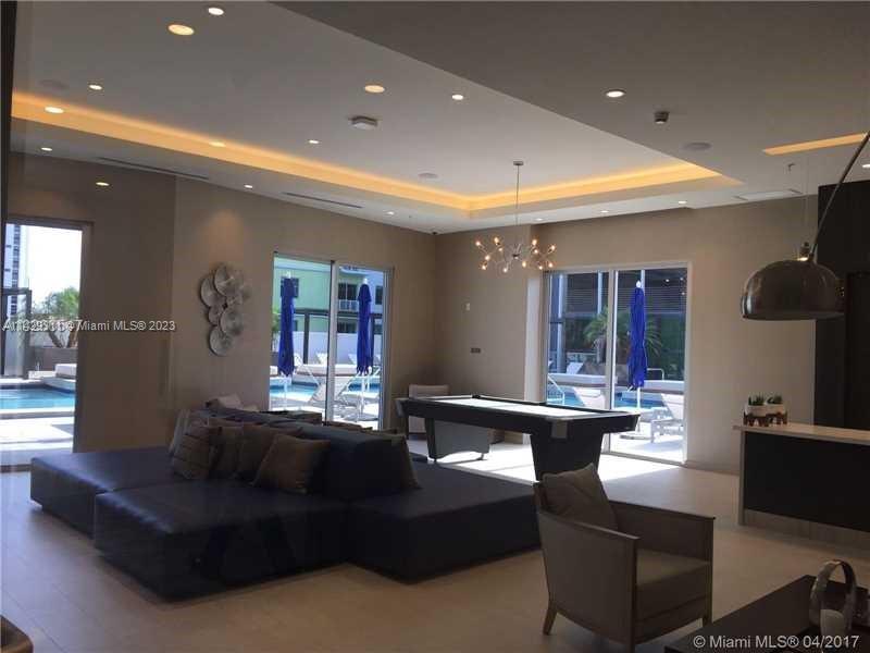 Brickell Miami, FL 33130 - Photo 8 of 9 a living room with furniture and a large window