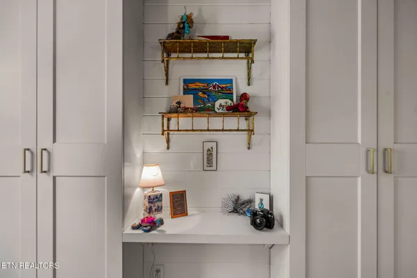 a bathroom with a granite countertop sink mirror vanity and a toilet