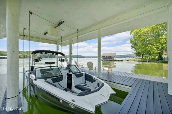 a balcony with furniture and a fireplace