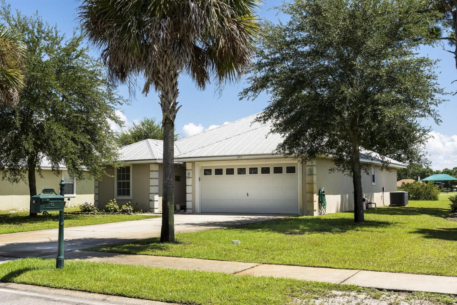 235 South Harborview Road Santa Rosa Beach, FL 32459 - Photo 1 of 12 a view of a house with a yard