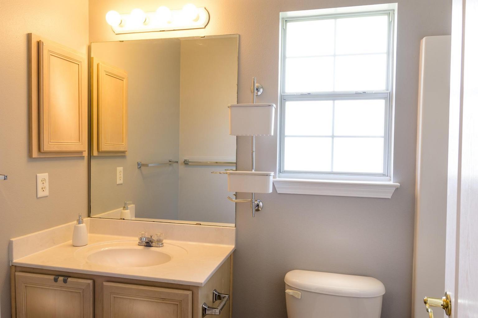 235 South Harborview Road Santa Rosa Beach, FL 32459 - Photo 11 of 12 a bathroom with a sink a toilet and a window