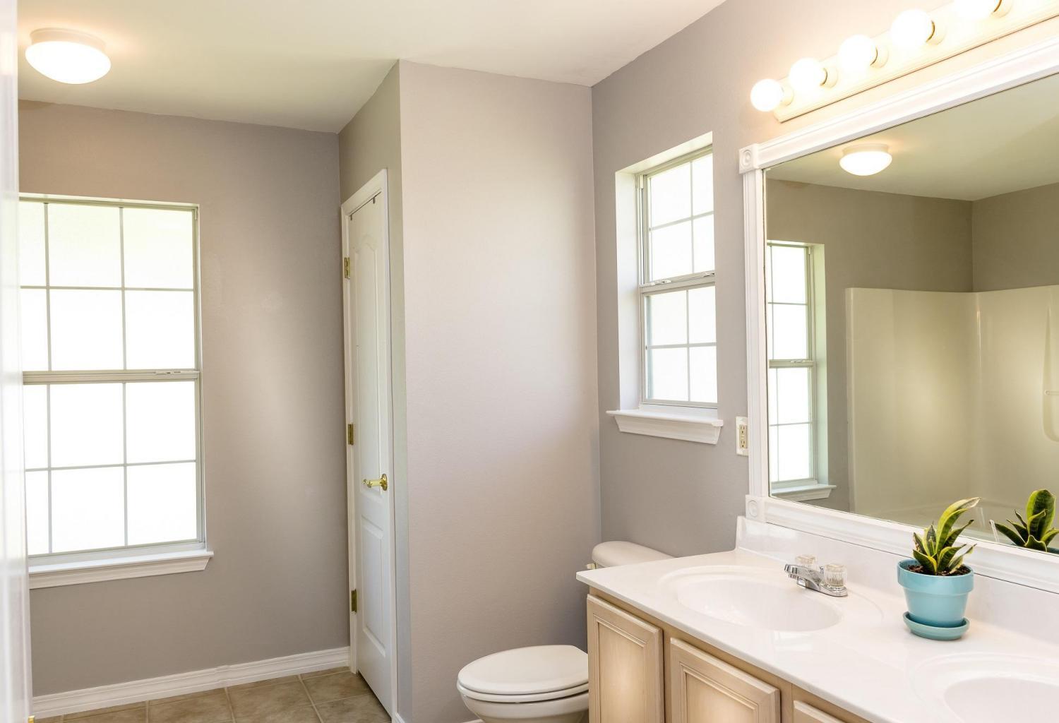 235 South Harborview Road Santa Rosa Beach, FL 32459 - Photo 3 of 12 a bathroom with a sink toilet and window
