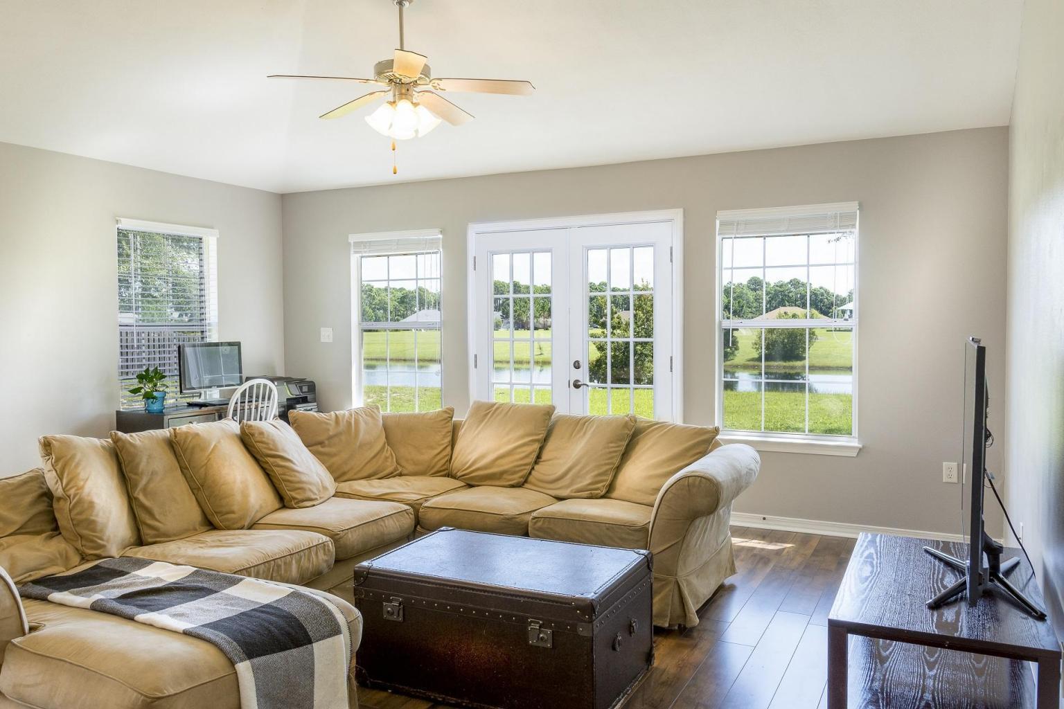 235 South Harborview Road Santa Rosa Beach, FL 32459 - Photo 5 of 12 a living room with furniture and a window