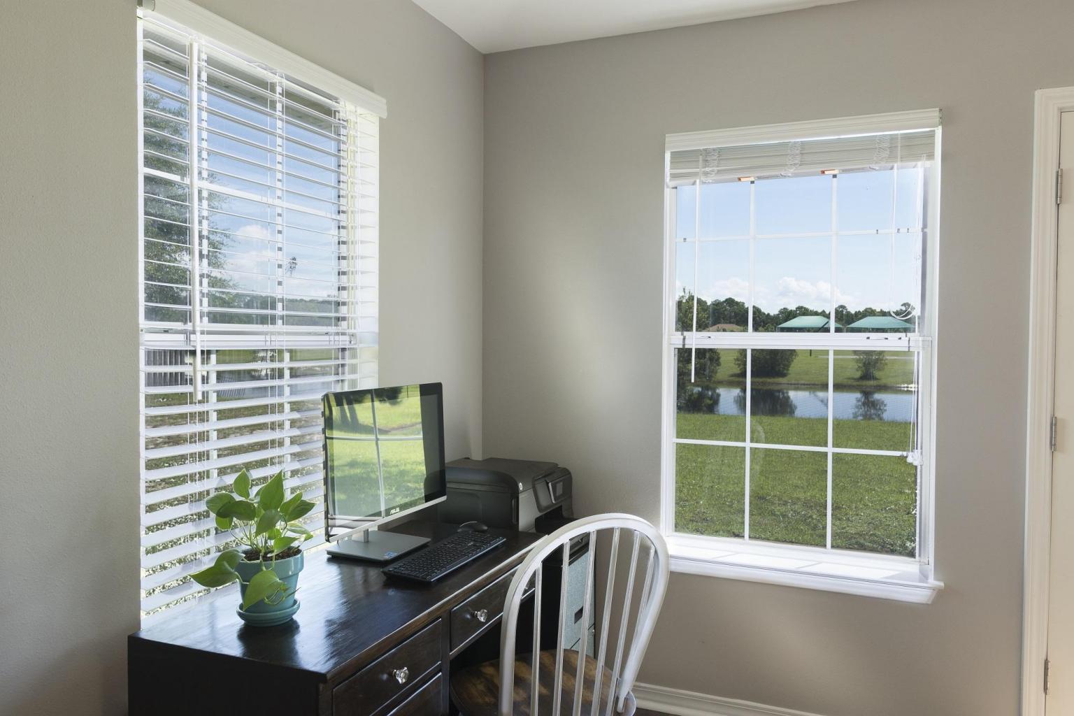 235 South Harborview Road Santa Rosa Beach, FL 32459 - Photo 7 of 12 a view of a window with a potted plant on a table