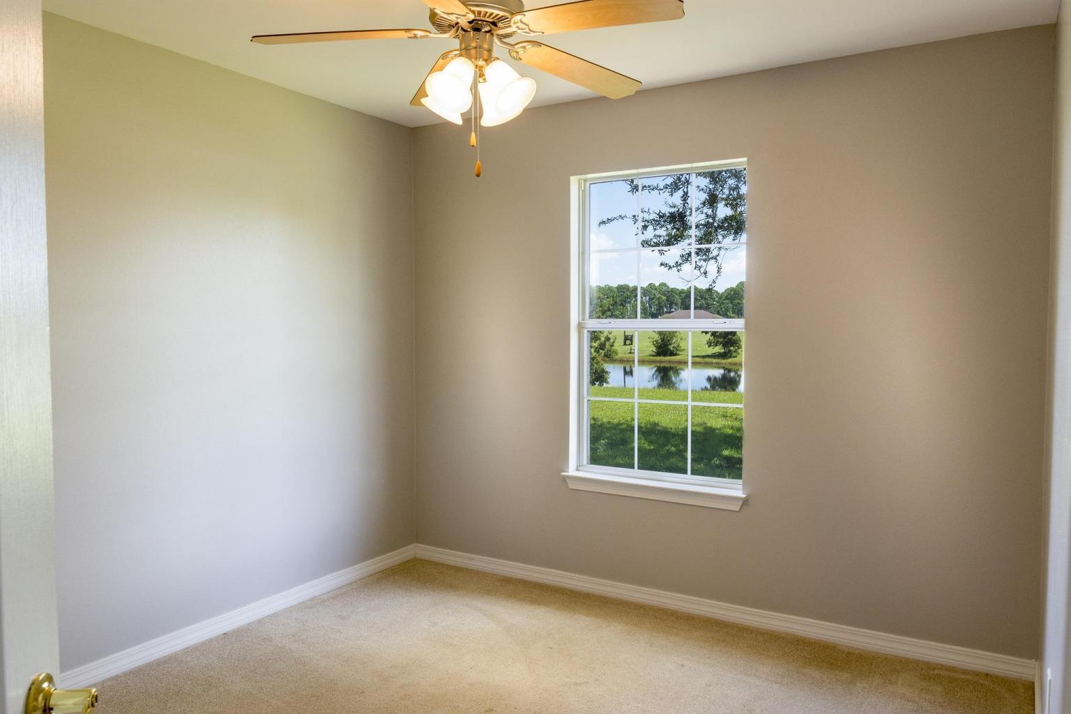 235 South Harborview Road Santa Rosa Beach, FL 32459 - Photo 10 of 12 an empty room with a window and a fan