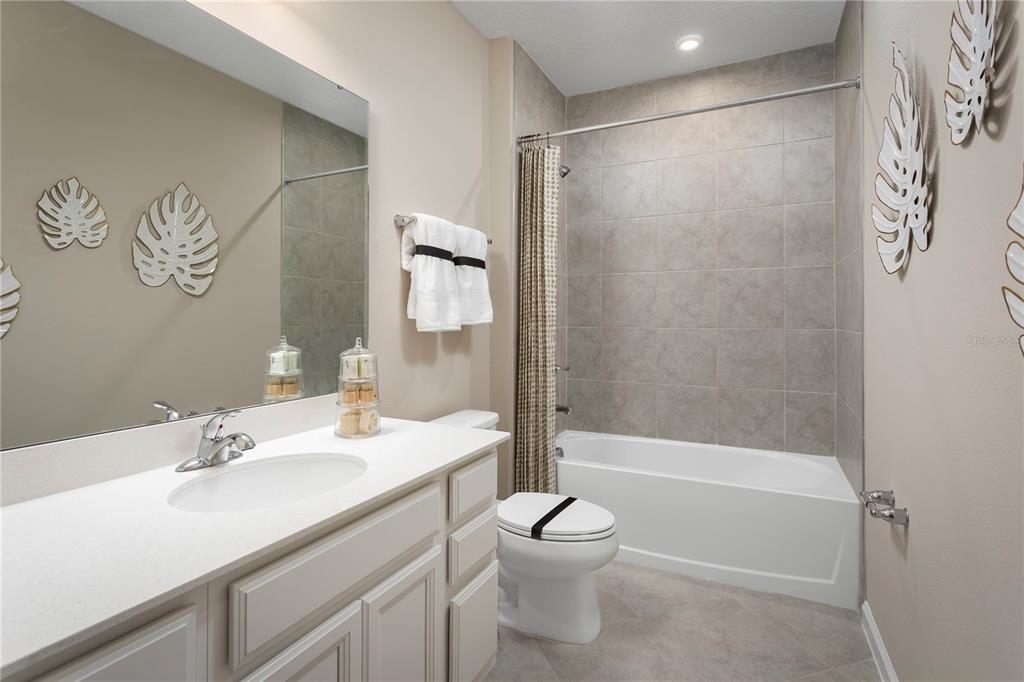 2313 Scenic Pk Loop Wimauma, FL 33598 - Photo 17 of 19 a bathroom with a sink toilet and shower