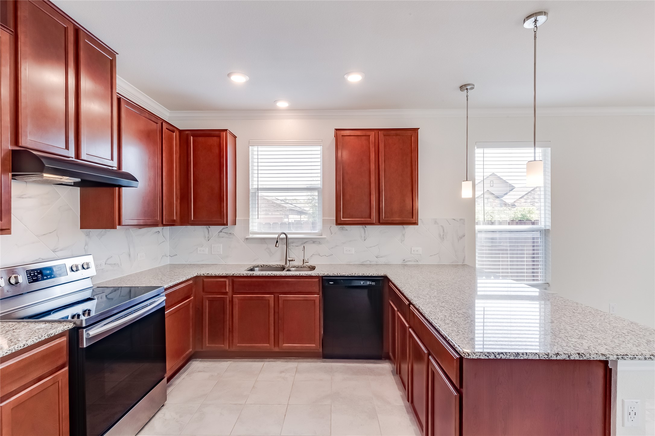 2007 Fretboard Street Round Rock, TX 78664 - Photo 12 of 40 a kitchen with stainless steel appliances granite countertop sink stove top oven and cabinets
