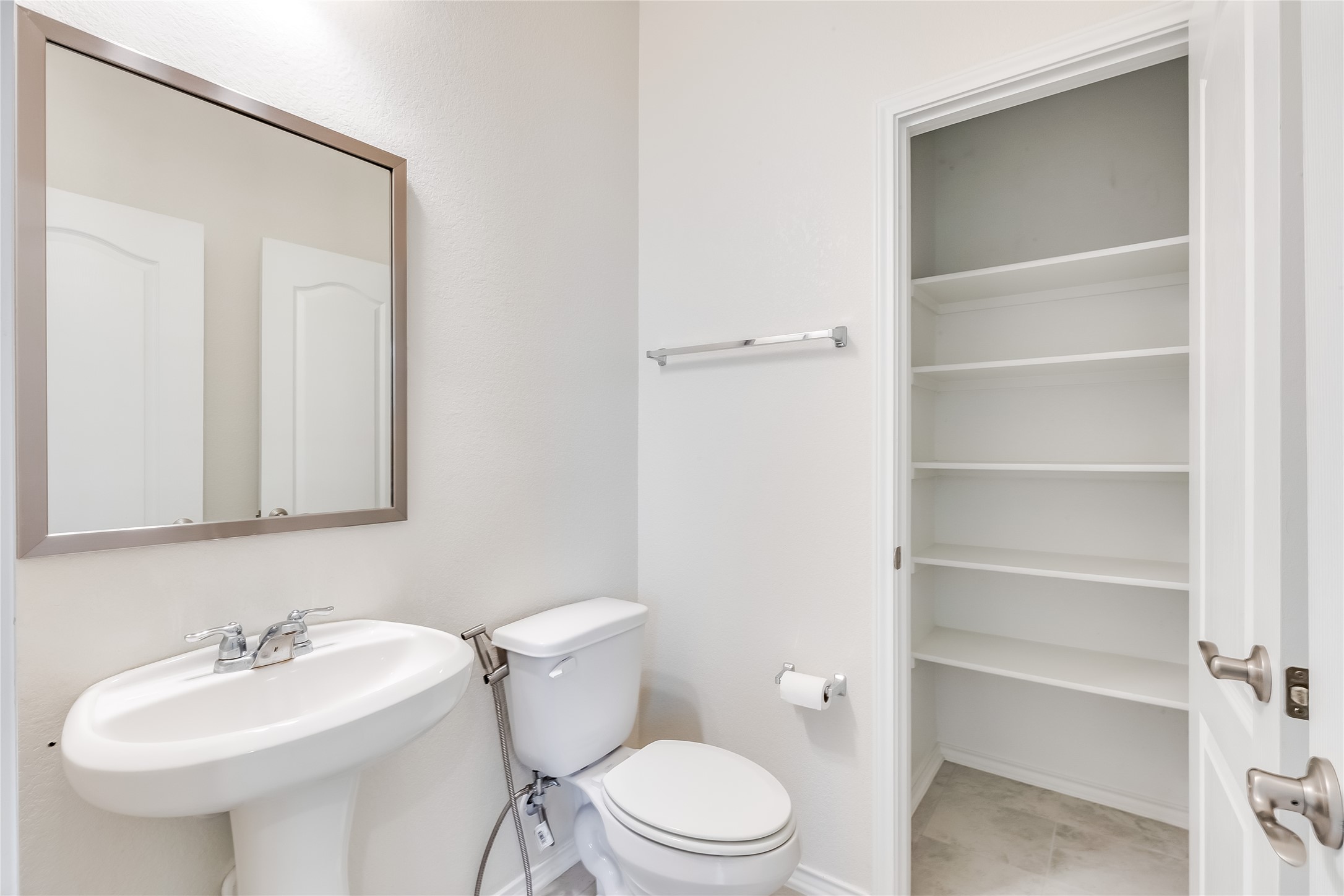 2007 Fretboard Street Round Rock, TX 78664 - Photo 16 of 40 a white toilet sitting next to a bathroom sink