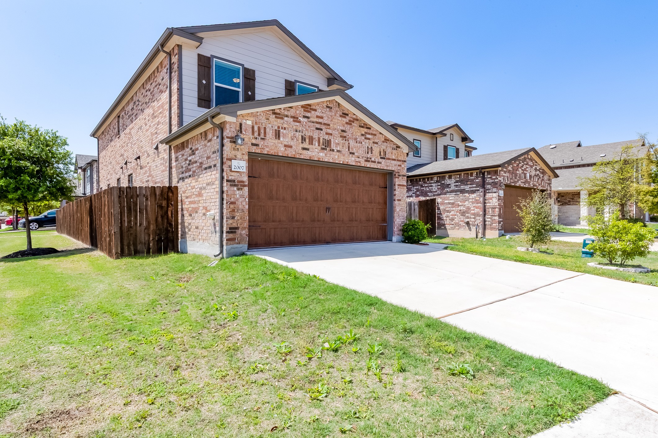 2007 Fretboard Street Round Rock, TX 78664 - Photo 2 of 40 a front view of a house with a yard and garage