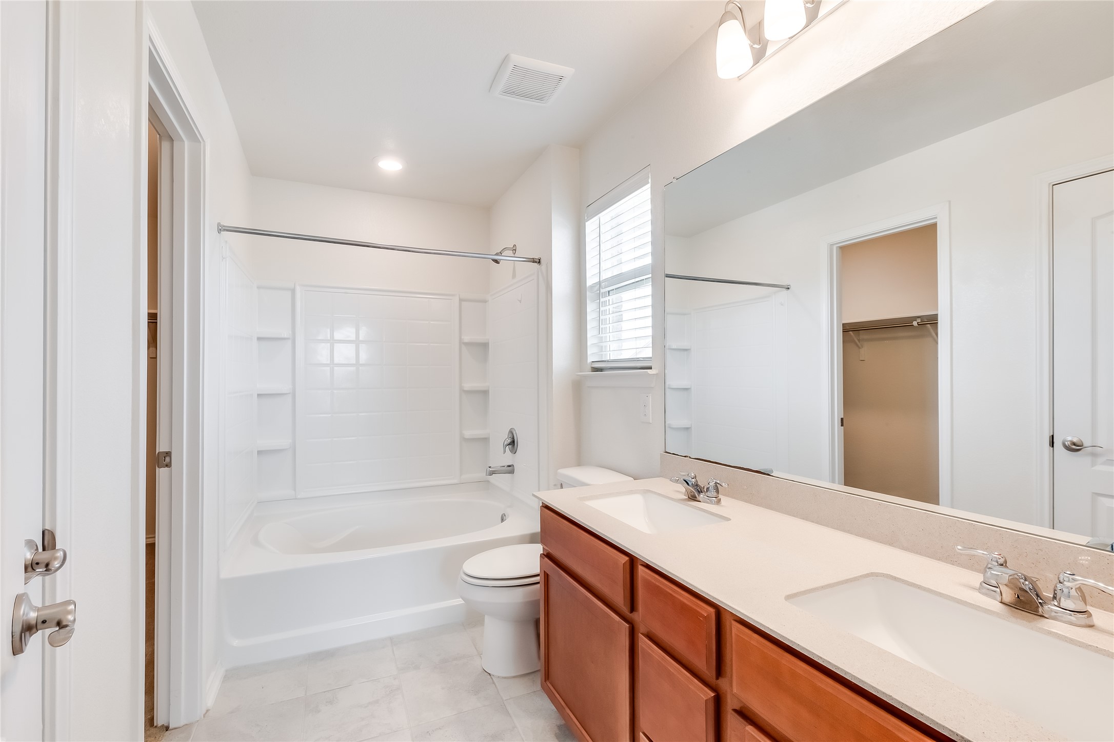 2007 Fretboard Street Round Rock, TX 78664 - Photo 23 of 40 a bathroom with a granite countertop sink a toilet and shower