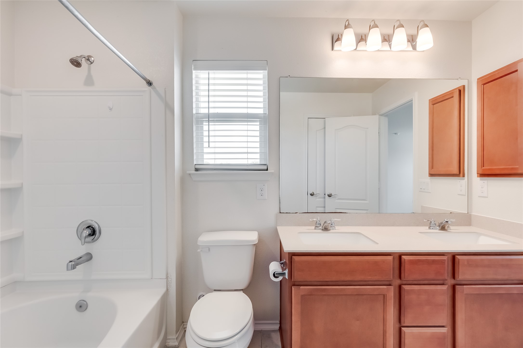2007 Fretboard Street Round Rock, TX 78664 - Photo 24 of 40 a bathroom with a sink a toilet and bathtub