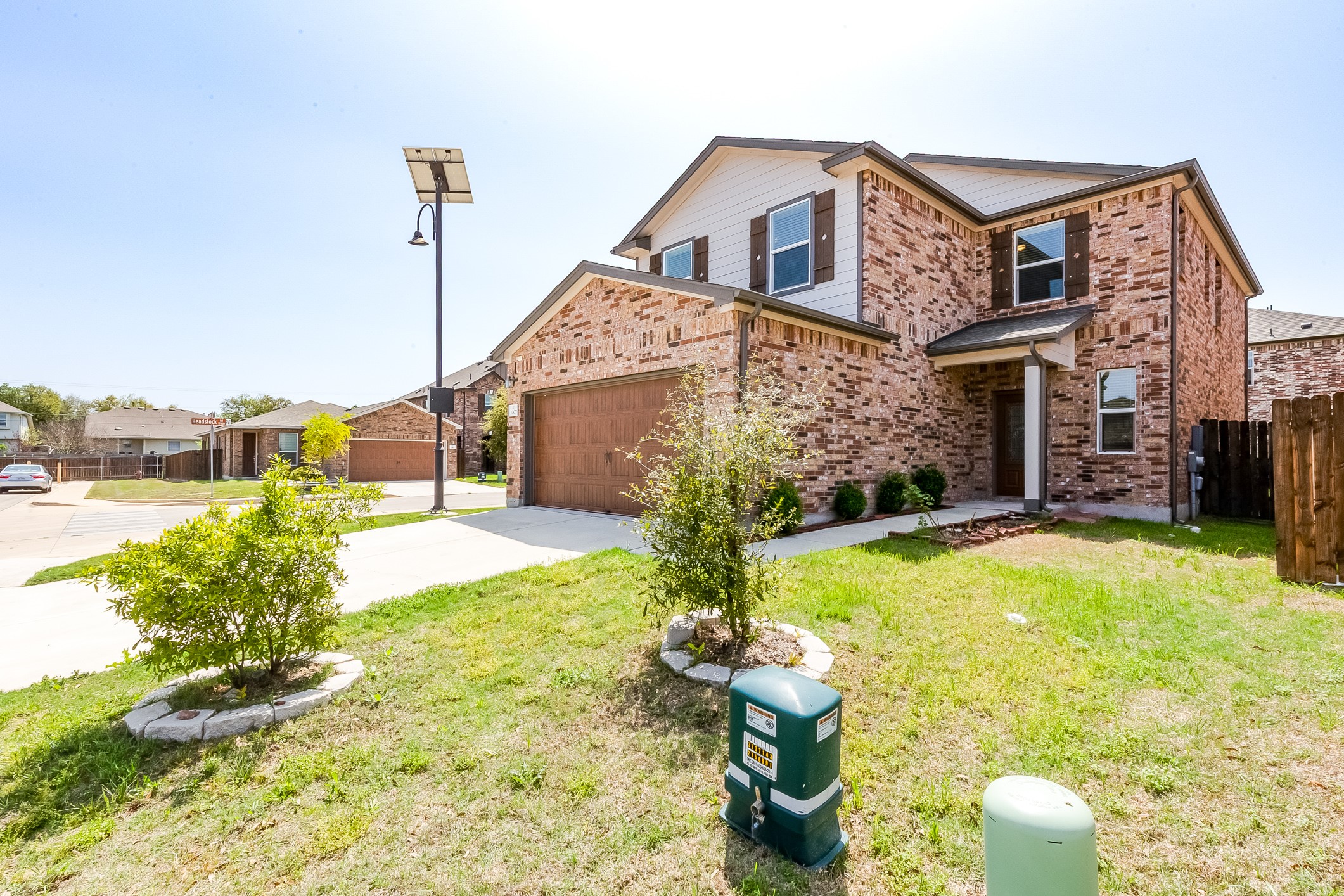2007 Fretboard Street Round Rock, TX 78664 - Photo 3 of 40 a yellow house with yard in front of it