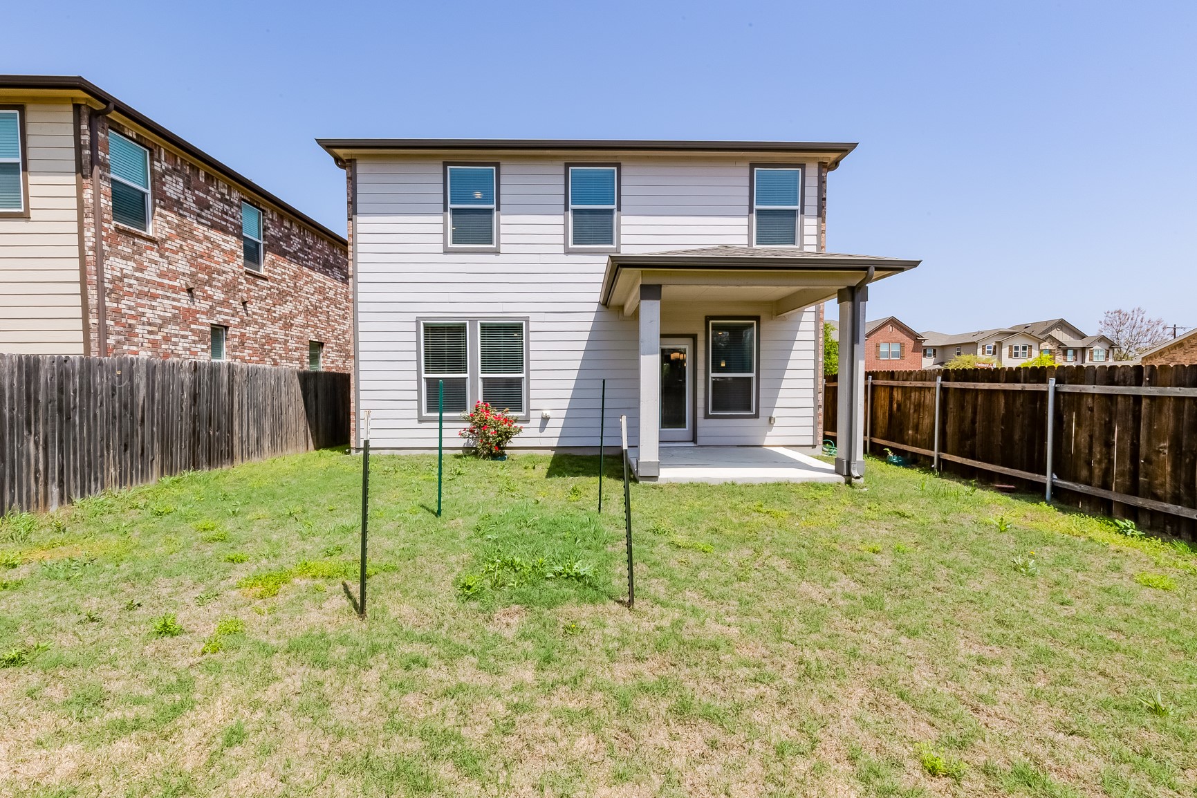2007 Fretboard Street Round Rock, TX 78664 - Photo 30 of 40 a view of a house with a backyard and a wooden fence