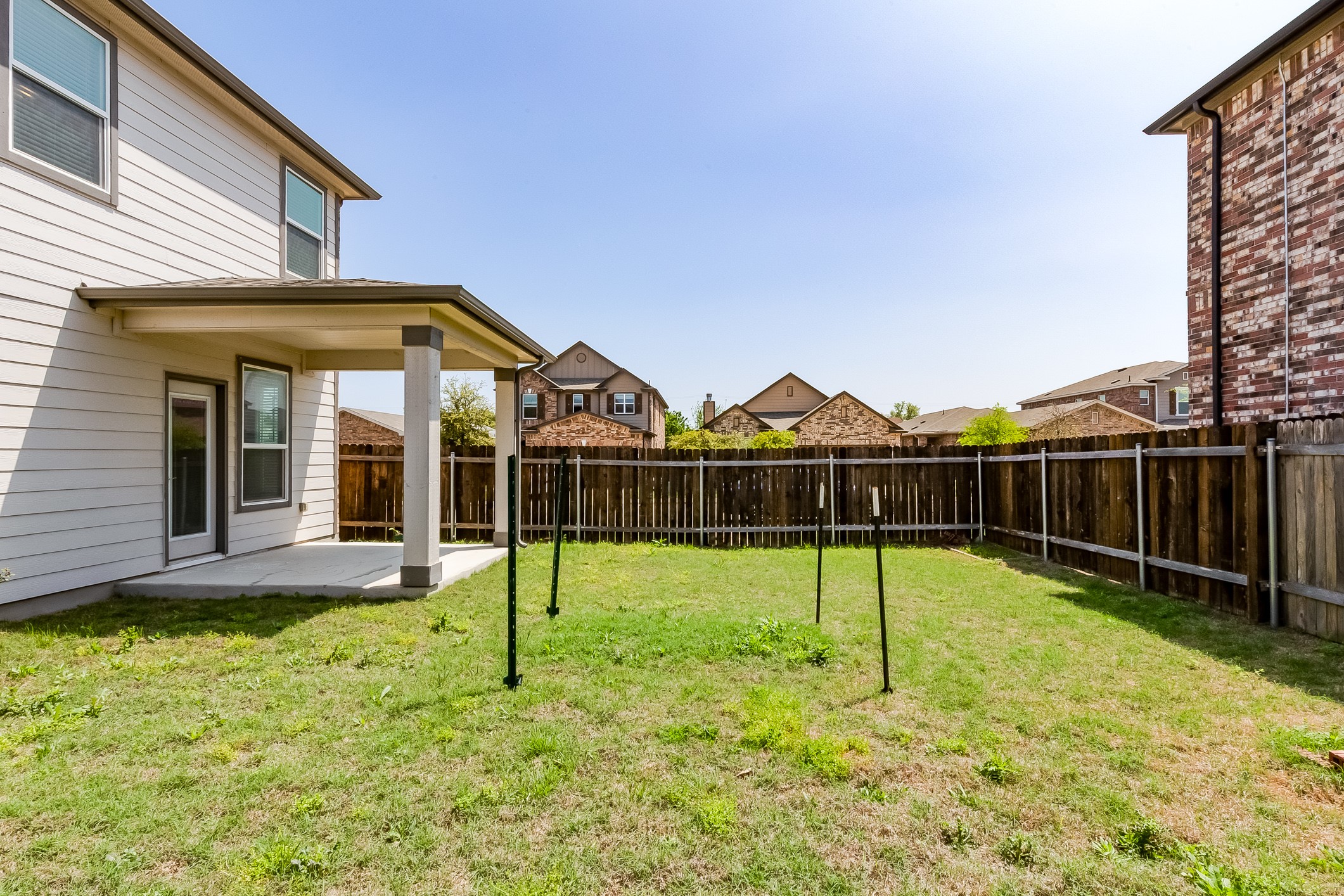 2007 Fretboard Street Round Rock, TX 78664 - Photo 33 of 40 a view of a house with a yard and sitting area