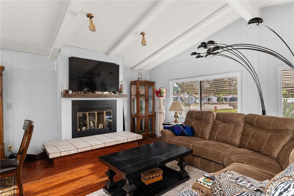 13381 Magnolia, Unit 35 Corona, CA 92879 - Photo 11 of 39 a living room with furniture fireplace and flat screen tv