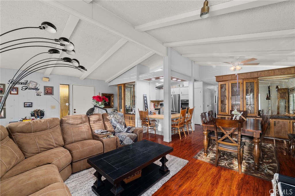 13381 Magnolia, Unit 35 Corona, CA 92879 - Photo 13 of 39 a living room with furniture and a chandelier