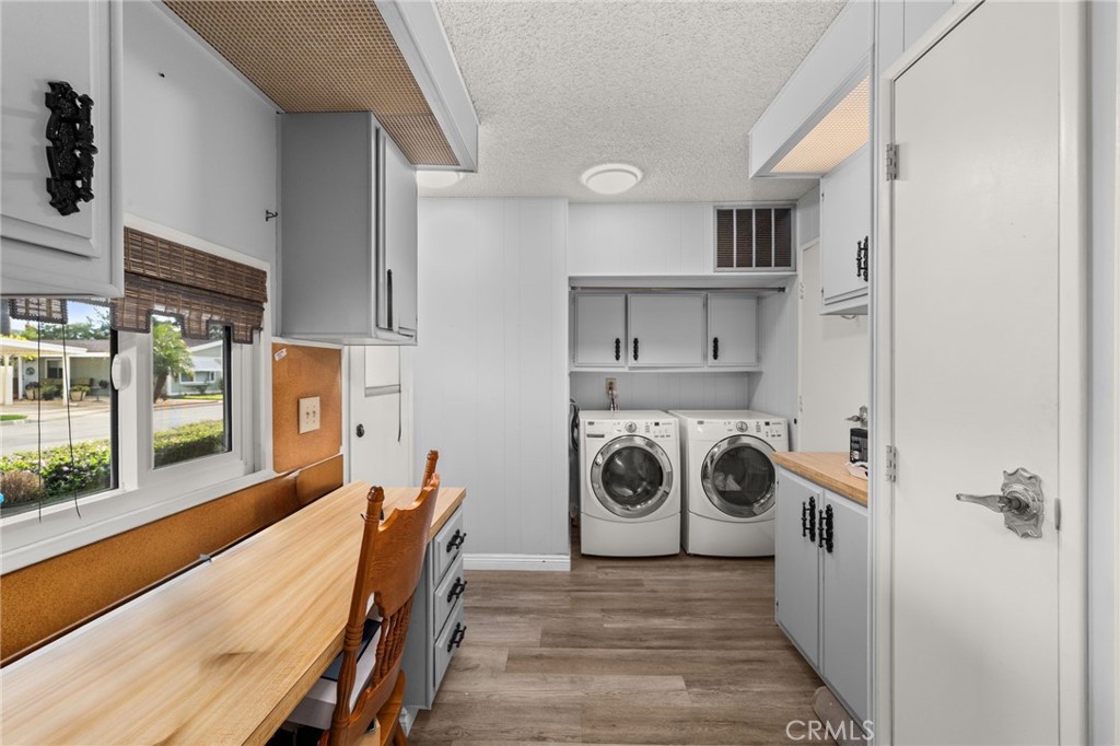 13381 Magnolia, Unit 35 Corona, CA 92879 - Photo 15 of 39 a view of a kitchen with furniture and wooden floor