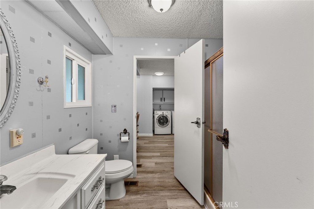 13381 Magnolia, Unit 35 Corona, CA 92879 - Photo 17 of 39 a bathroom with a sink toilet and shower