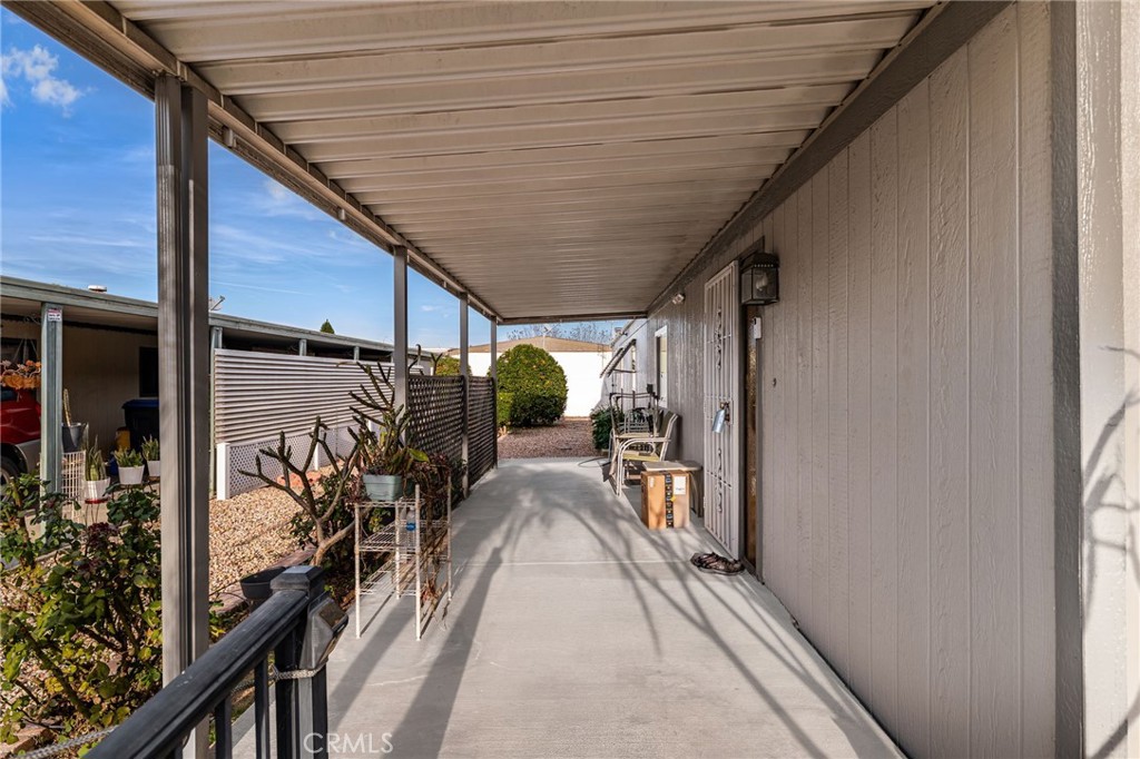 13381 Magnolia, Unit 35 Corona, CA 92879 - Photo 27 of 39 a view of a porch with wooden floor and stairs