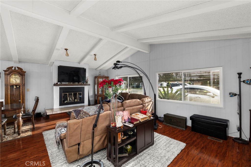 13381 Magnolia, Unit 35 Corona, CA 92879 - Photo 9 of 39 a living room with furniture fireplace and a flat screen tv