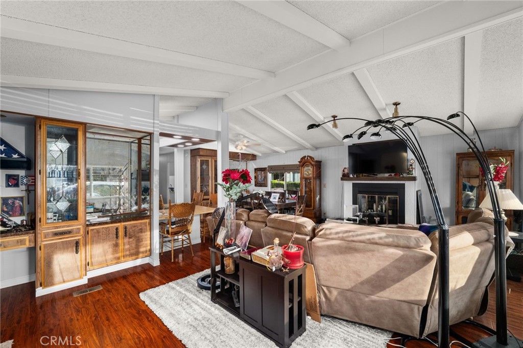 13381 Magnolia, Unit 35 Corona, CA 92879 - Photo 10 of 39 a view of a living room with furniture and a fireplace