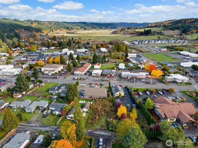 an aerial view of residential houses with outdoor space