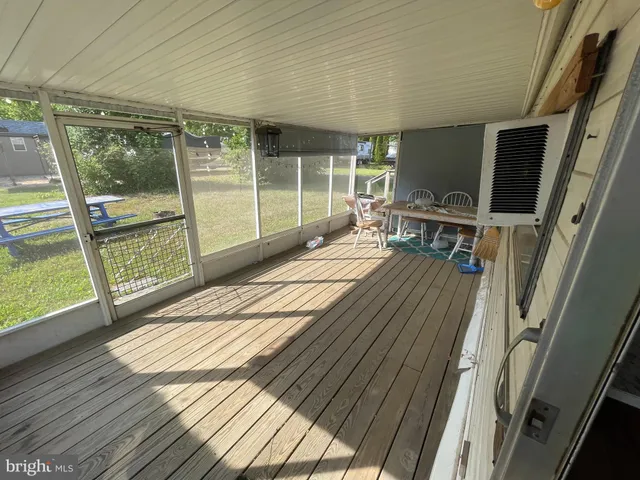 a bed sitting in a bedroom next to a large window
