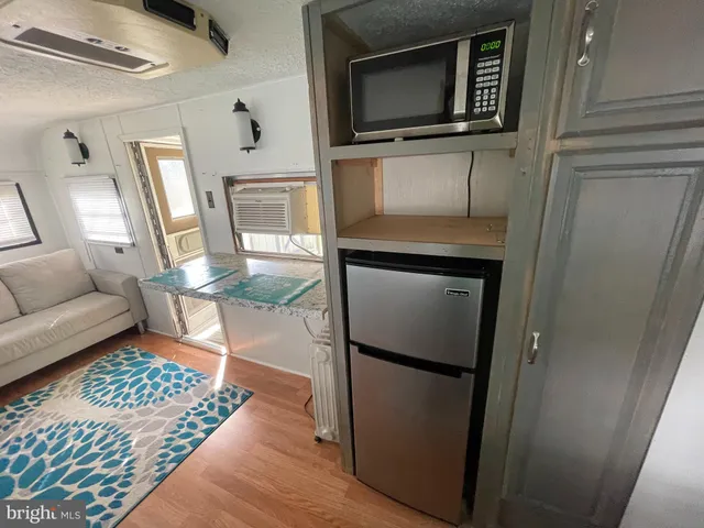 a living room with a fireplace furniture and a flat screen tv
