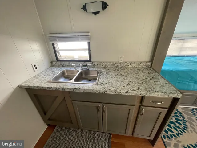 a sink sitting next to a window