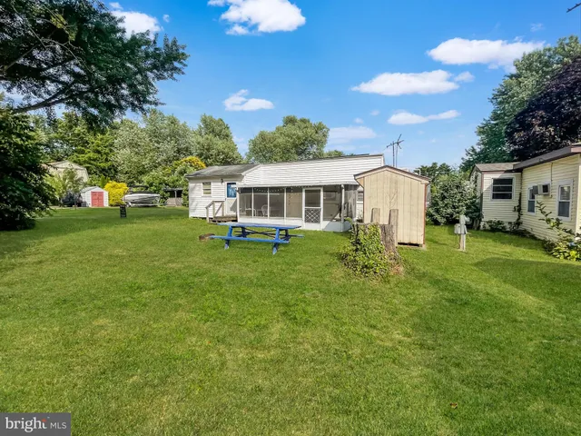 a view of a house with a big yard