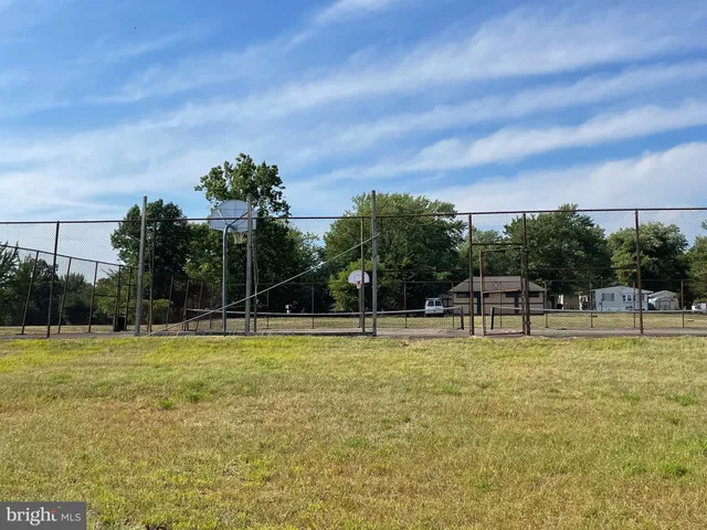 a view of a swimming pool with a yard