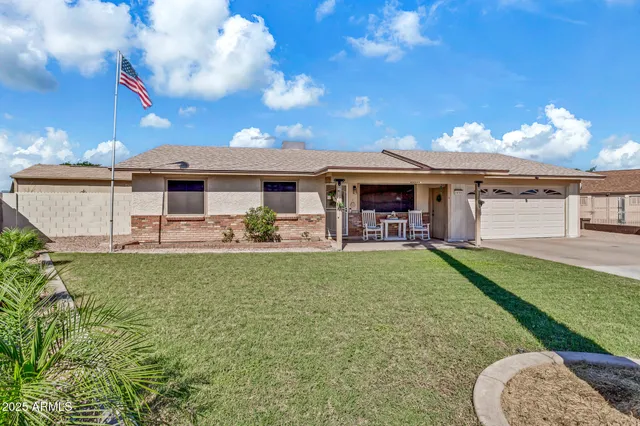 a view of a house with backyard porch and furniture