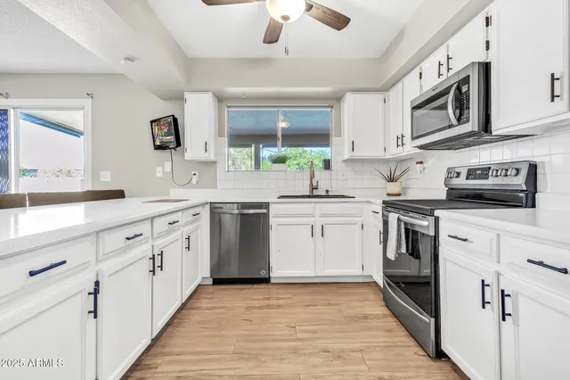 a kitchen with a stove and a microwave