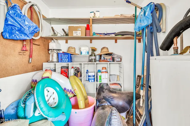 a living room with furniture a rug and a window