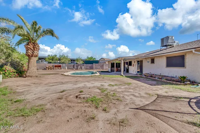 a front view of a house with cars parked