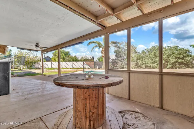 a view of a swimming pool with a yard