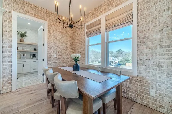 a kitchen with cabinets and wooden floor