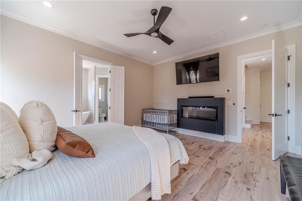 1009 Easy Street Winder, GA 30680 - Photo 23 of 78 a bedroom with a bed and a chair