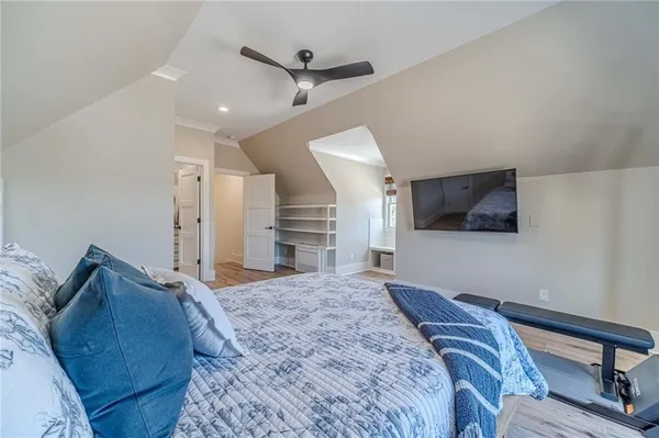 a living room with furniture and a baby crib
