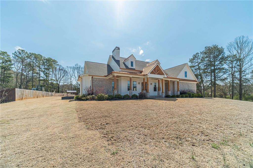 1009 Easy Street Winder, GA 30680 - Photo 4 of 78 a front view of a house with a yard