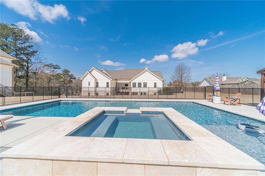 1009 Easy Street Winder, GA 30680 - Photo 57 of 78 a view of swimming pool with outdoor seating