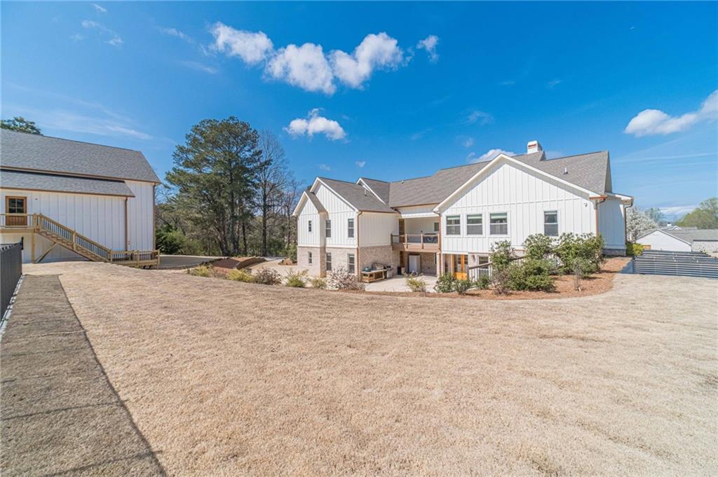 1009 Easy Street Winder, GA 30680 - Photo 67 of 78 a view of a house with a yard and large trees