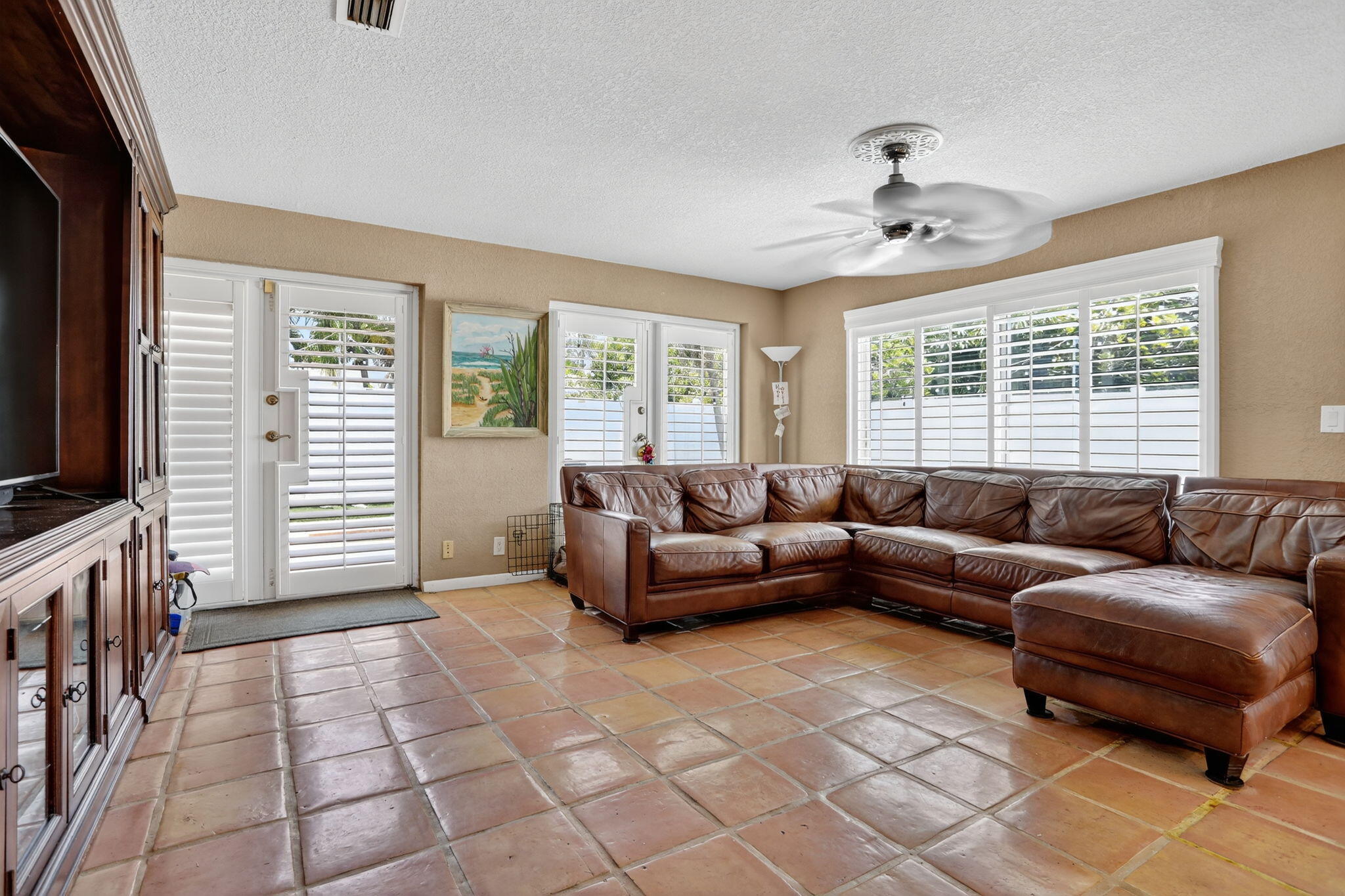 1960 Northeast 31st Street Lighthouse Point, FL 33064 - Photo 11 of 27 a living room with furniture and a flat screen tv
