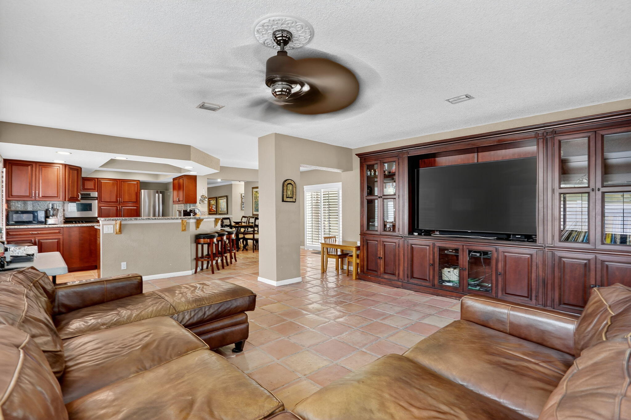 1960 Northeast 31st Street Lighthouse Point, FL 33064 - Photo 13 of 27 a living room with furniture and a flat screen tv